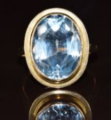 A 9ct gold ring set with an oval cut synthetic spinel, 6.4g, size N