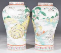 Pair of early 20thC Chinese baluster vases with enamelled lake / river decoration with figures and