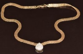 A 14ct gold necklace set with diamonds in a pear shaped setting, 9.1g, 40cm