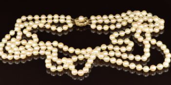 A three strand cultured pearl necklace with 9ct gold clasp, 71.4g, 46cm