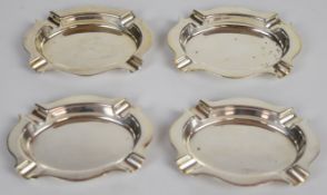 Set of four Elizabeth II hallmarked silver ashtrays, Birmingham 1957, maker Henry Clifford Davis,