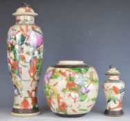 Chinese crackle glazed covered vase, ginger jar and small vase, all decorated with battle scenes /