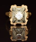 An 18k bi-coloured gold ring set with paste, 3.9g, size R