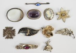 Nine silver brooches including Siam, butterfly wing, etc