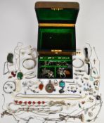 A collection of silver jewellery including twelve rings, bangle, bracelet, brooch, four chains,