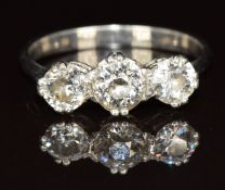 An 18ct white gold and platinum ring set with three diamonds of approximately 0.6, 0.3 & 0.3ct, 2.