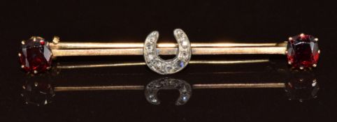 Victorian brooch set with rose cut diamonds in a horseshoe setting and two garnets, 3g, 4.5cm