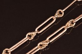 A c1920 9ct rose gold Albert/watch chain made up of knotted and elongated links, 31.4g, 40cm
