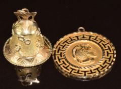 A 14k gold pendant (2.7g) and a yellow metal charm in the form of a bell (3.1g)