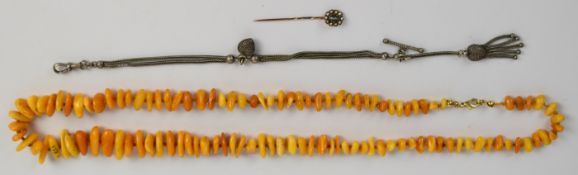 A beaded amber necklace, Victorian stick pin set with chrysoberyl and seed pearls and Victorian