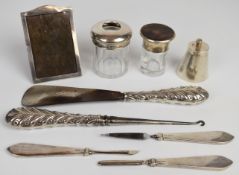 Hallmarked silver mounted items comprising photograph frame, height 10cm, button hook and shoe horn,