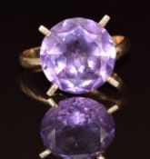 A 14ct gold ring set with a synthetic purple sapphire, 4.7g (band cut)
