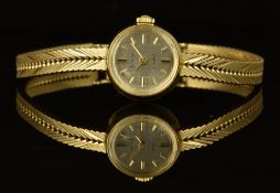 Accurist 9ct gold ladies wristwatch with gold hands and hour markers, silver dial and signed 17