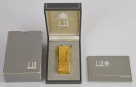 Dunhill lighter in original case and outer box with paperwork. Unused.