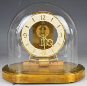 Kundo electric pendulum clock under glass dome, overall height 21.5cm