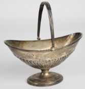 Victorian hallmarked silver swing handled basket with fluted lower body, Sheffield 1874, maker Henry