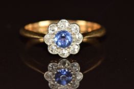 Art Deco 18ct gold ring set with a round cut sapphire surrounded by diamonds, 2g, size I