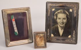 Three hallmarked silver photograph frames comprising two to suit 5 x 3 1/2 inch photographs and a