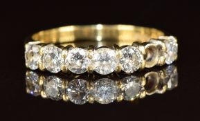An 18ct gold half eternity ring set with six diamonds, each approximately 0.14ct (one missing), 2.