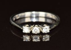 An 18ct white gold ring set with three diamonds, 2.1g, size L