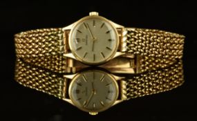 Omega 9ct gold ladies wristwatch ref. 511.5499 with black hands, two-tone baton hour markers, silver