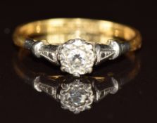 An 18ct gold ring set with a diamond in platinum setting, 2g, size K