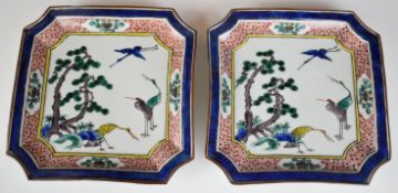 Pair of Chinese stamped plates with enamelled decoration of cranes / storks, diameter 23cm