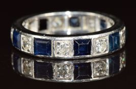 Art Deco white metal eternity ring set with eight rectangular cut sapphires of approximately 0.