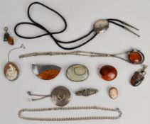A collection of silver jewellery including curb link necklace, two agate brooches, two cameo
