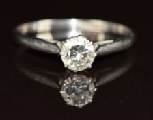 A platinum ring set with a round cut diamond of approximately 0.5ct, 2.4g, size O