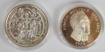 Two five ounce silver coins or medallions, one a Panama 20 Bilboas, the other hallmarked and