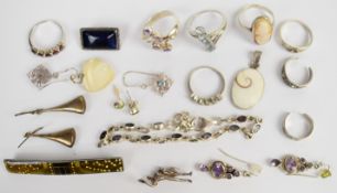 A collection of silver jewellery including eight rings, bracelet set with amethysts, four pairs of