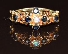 A 9ct gold ring set with an opal and sapphires, 2g, size K