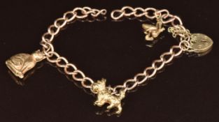 A 9ct gold charm bracelet with three 9ct gold charms comprising dog, cat and stork, 6.8g, 18.5cm (