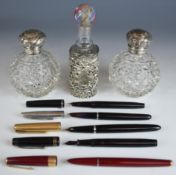 A pair of hallmarked silver mounted cut glass scent bottles, Birmingham 1900, maker John Henry Wynn,