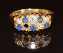 A yellow metal c1900 ring set with sapphires and diamonds, 3.7g, size Q (one diamond missing)