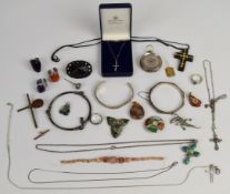 A collection of jewellery including three silver crosses, silver pocket watch, Miracle brooch,