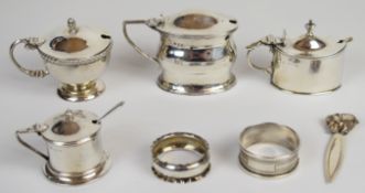 Hallmarked silver items comprising five various salts, all but one with blue glass liner, two napkin