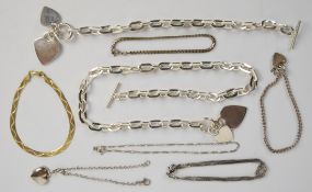 A silver necklace made up of oval links and heart pendants, with matching bracelet (95g) and four