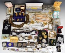 A collection of jewellery including vintage brooches, Trifari necklace and earrings, three pairs
