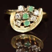 A yellow metal ring set with diamonds and emeralds, 3.5g, size N