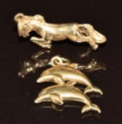 Two 9ct gold charms, one in the form of a horse and the other of two dolphins, 3.2g