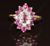 A 9ct gold ring set with rubies and diamonds in a marquise shaped setting, 2.1g, size N