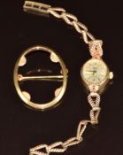 A 9ct gold ladies watch and 9ct gold brooch mount, 10.7g