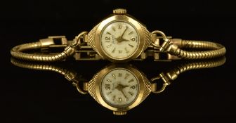 Lacorda 9ct gold ladies wristwatch with gold hands and hour markers, silver dial and mechanical