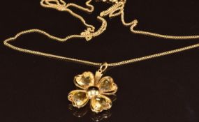 An 18k gold pendant in the form of a four leaf clover set with heart cut citrines (2.5cm) on 18k