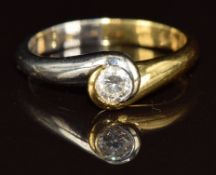 An 18ct bi-coloured gold ring set with a round cut diamond of approximately 0.25ct, 4.3g, size N