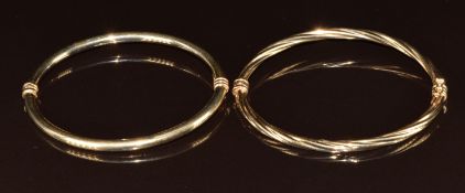 Two 9ct gold bangles, one in a twisted design, 8.5g, 5.8 x 4.8cm