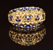 An 18ct gold ring set with blue enamel, 5.3g, size L