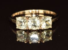 A 9ct gold ring set with three round cut csarite, size Q